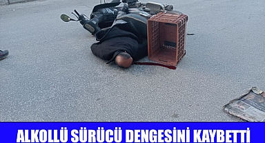 Alkollü sürücü dengesini kaybederek yere düştü